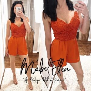 Blāshe orange laced sleeveless romper size Small